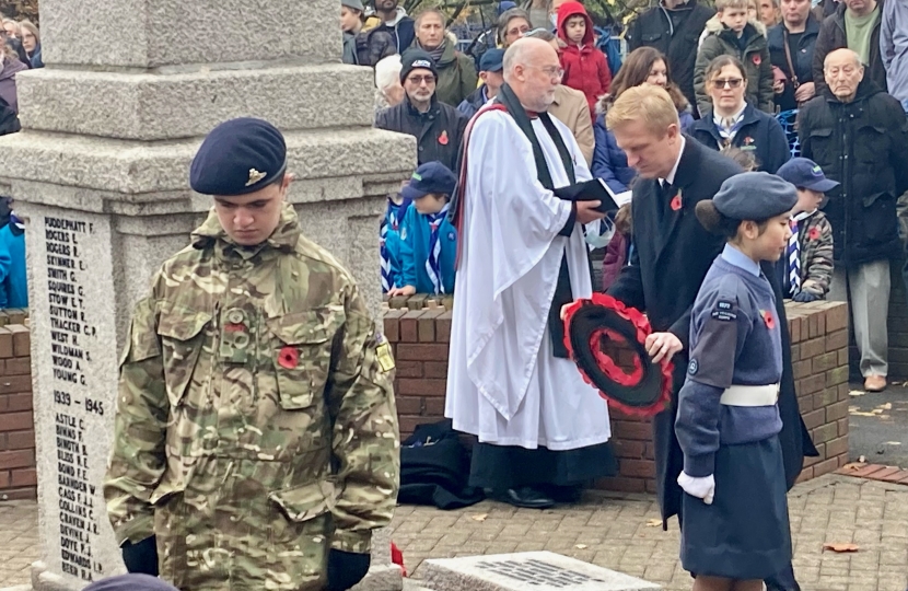 Oliver lays the wreath