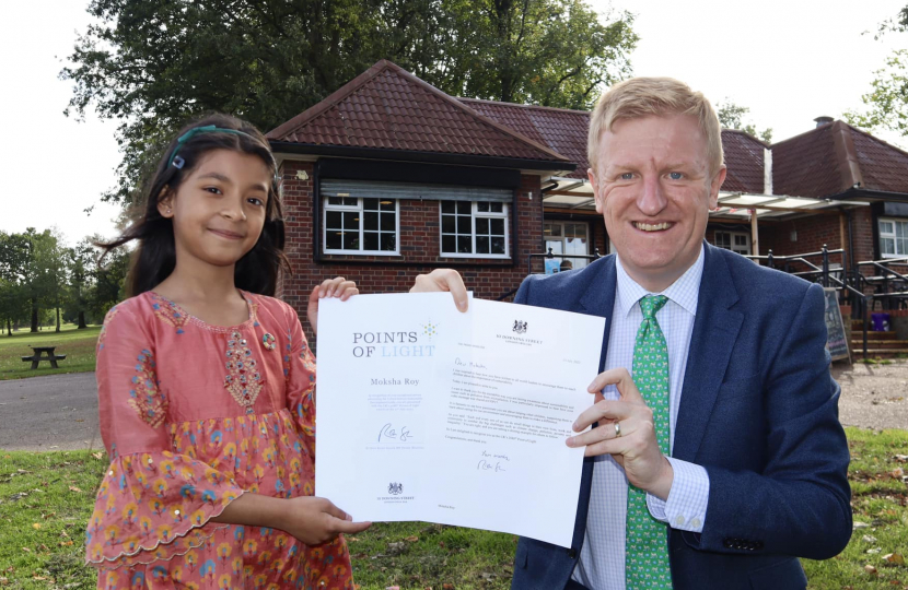 Mr Dowden presenting Moksha Roy with the Points of Light Award.