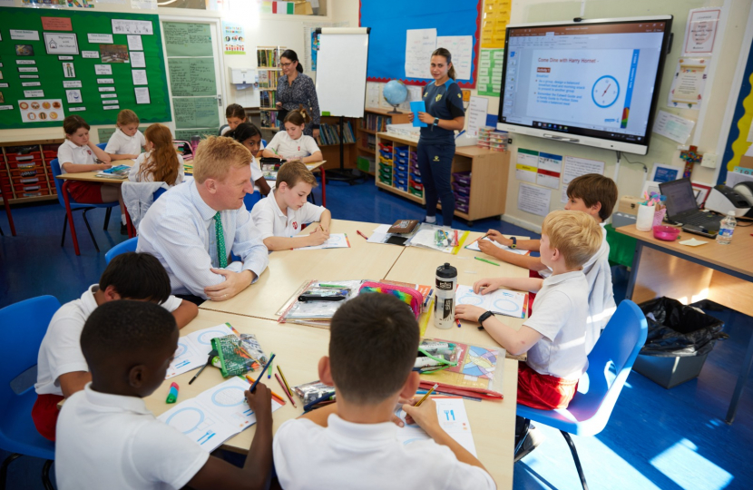 Mr Dowden with pupils at Sacred Heart Primary School learning about healthy meals