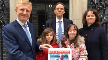 Oliver Dowden MP with the Foroughi family handing petition into No.10 Downing Street