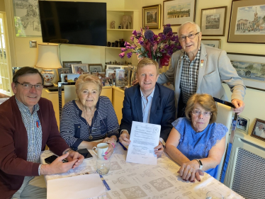 Mr Dowden with members of Woodcock Hill Village Green Committee