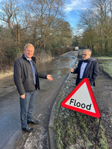 Oliver and Cllr Morris Bright MBE Inspecting Road Surfaces at Rectory Lane in Shenley